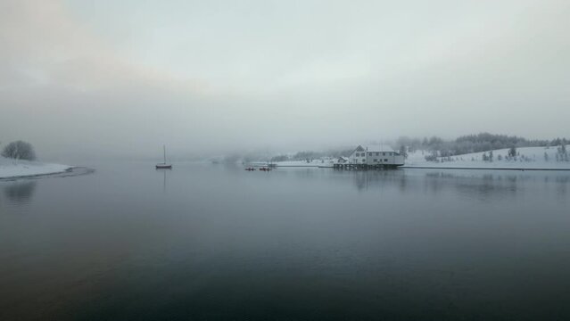 Nordic landscape on cloudy day, Kvaloya or Sallir island, Tromso in Norway. Aerial sideways and space for copy