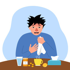 Sick man suffering from flu sitting with medicine, tissue paper, water and lemon on table. He sneezing in handkerchief and has fever.