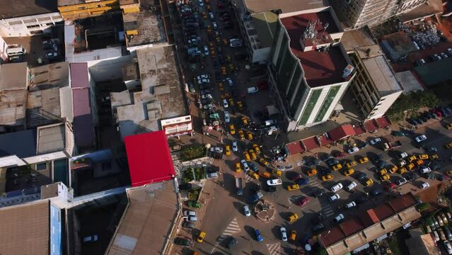 Aerial view tilting towards a traffic jam on the streets of Yaounde, Cameroon
