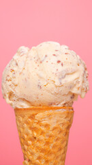 Close-up vertical of chocolate chip ice cream inside an ice cream cone.