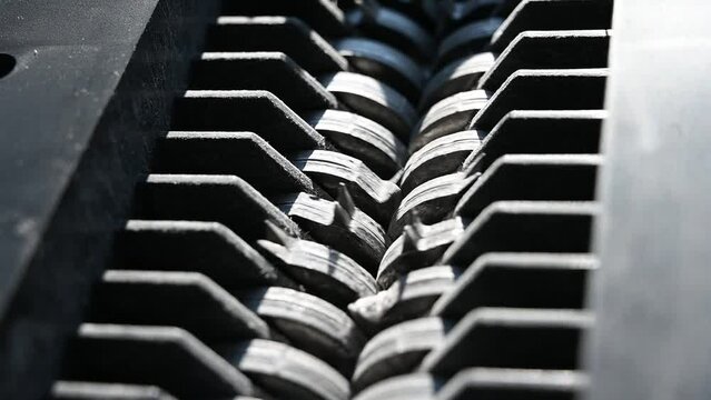 closeup view of office paper shredder teeth 