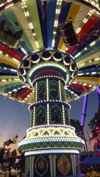 NPE Pleasure and leisure park for children and adults swings and attractions Evening lights on swing Scary creepy swing in park Playland is an amusement park in Vancouver, British Columbia, Canada.