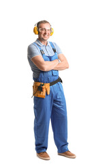 Mature carpenter in hearing protectors on white background
