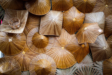 Hat, wickerwork, for covering the beach, protecting from hot weather, black drop image, focus on the spot ,background from the shells