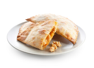 Plate with baked meat empanadas on white background