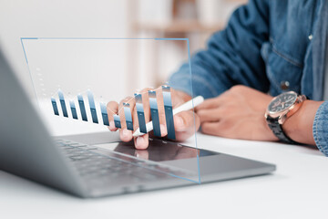 Businessman analyzing growth sales data graph on modern interface icons. digital online marketing Financial and investment business planning and development.