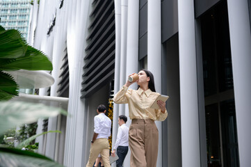 A young businesswoman is working in modern city downtown of Singapore