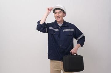 Portrait of male engineer wearing a protective helmet over white background studio.