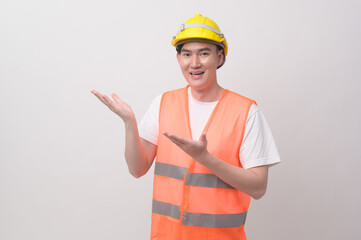 Portrait of male engineer wearing a protective helmet over white background studio.
