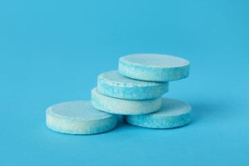 Fototapeta na wymiar Soluble tablets on blue background