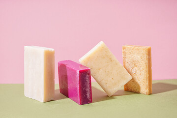 Set of natural soap bars on color background