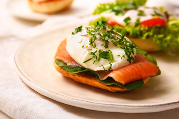 Plate with delicious egg Benedict on table, closeup
