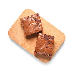 Wooden board with pieces of tasty chocolate brownie isolated on white background