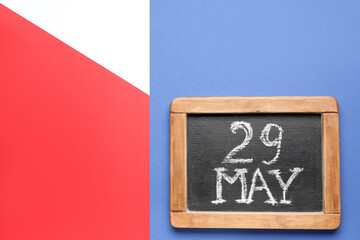 Chalkboard with date of Memorial Day on color background