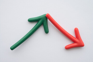 Arrow green rise up and red fall down volatility on white background. Business, financial and investment concept. Recession economy crisis, fluctuation in stock market, cryptocurrency.