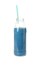 Glass bottle of tasty blue smoothie with straw on white background