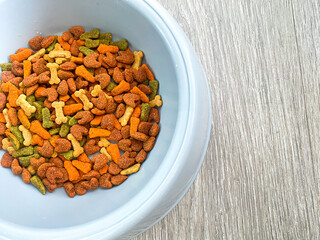 Dog food ready to eat on the wood background