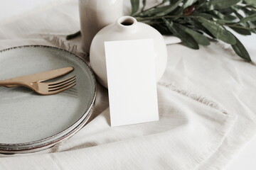 Card mockup on empty modern minimal table place setting neutral beige color .  Space for text....