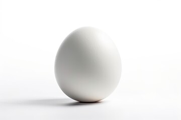 plain white egg resting on a minimalist white table. Generative AI