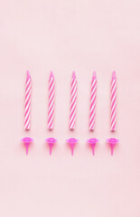 Birthday candles on pink background