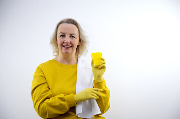 positive happy girl is dancing while working in the house. close up photo. isolated grey background. High quality photo