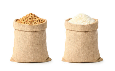 Paddy rice and white rice in burlap sack bag isolated on white background.