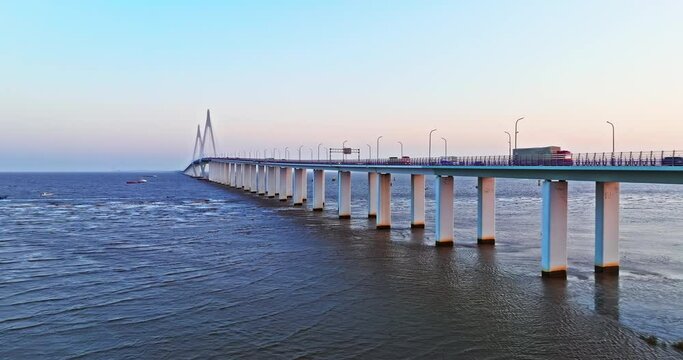 Aerial view of Hangzhou Bay Bridge scenery at sunset, Zhejiang Province, China. The total length of the bridge is 36 kilometers. The design speed is 100 kilometers per hour.