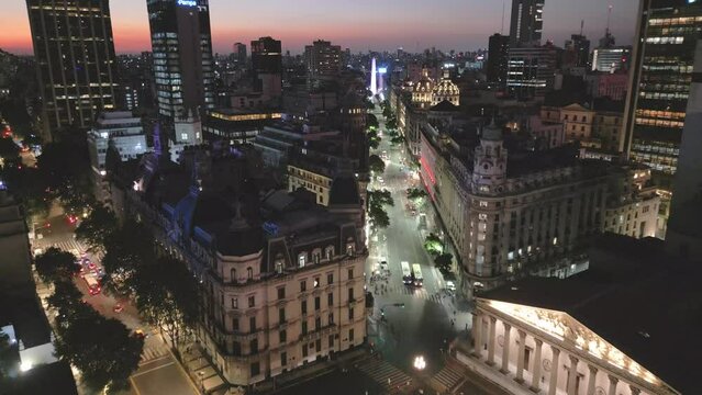 Aerial Drone Above Buenos Aires City at Night, Obelisk and Business Urban Center through Diagonal Norte Avenue