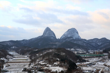 a snowy landscape on a mountain peak