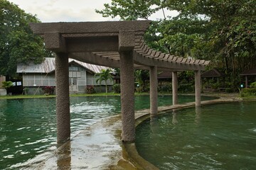 The Soda Water Pool in Camiguin in the Philippines which is surrounded by trees.