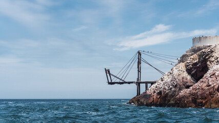 Fototapeta premium Old wooden bridge in the Ballestas islands at Paracas, ica Peru