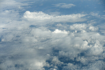 Fototapeta na wymiar Fluffy white clouds on the blue sky