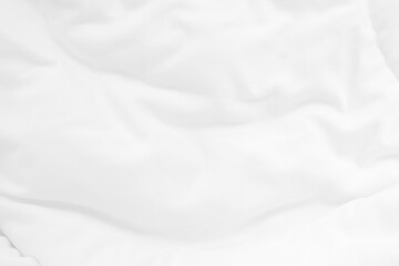 Close up top view of white bedding sheet and wrinkle messy blanket in bedroom after wake up in the...