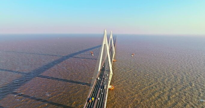 Aerial view of Hangzhou Bay Bridge scenery at sunset, Zhejiang Province, China. The total length of the bridge is 36 kilometers. The design speed is 100 kilometers per hour.