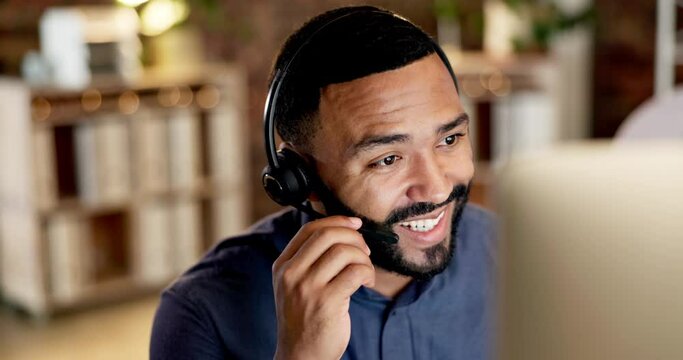 Businessman, call center and consulting with headphones at night in customer service or telemarketing at office. Happy male consultant agent smiling and working late talking with headset on computer