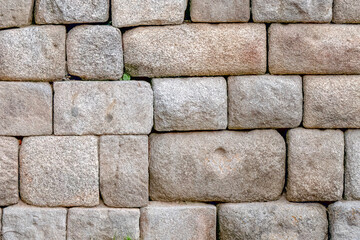 The surface of the ancient masonry of natural stones.