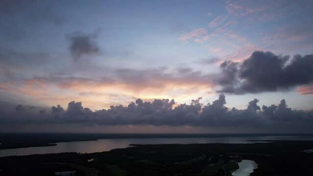 Sunset fly over the waters of the Gulf of Mexico. Located in Cancun, Mexico. Aerial 4K drone video