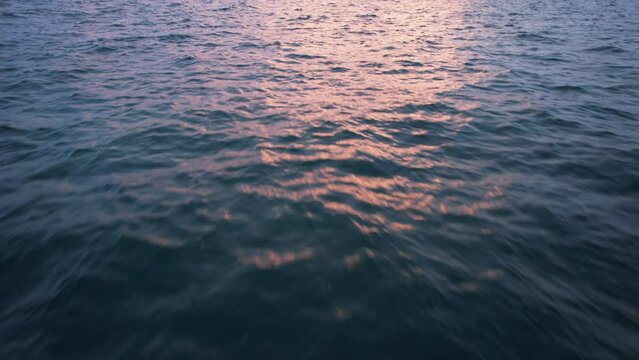 Sunset fly over the waters of the Gulf of Mexico. Located in Cancun, Mexico. Aerial 4K drone video