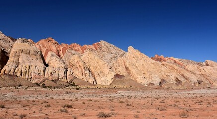 the  colorful flatiron rock formations in the san rafael reef near uneva canyon on a sunny day,...