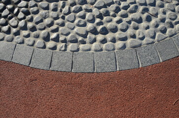 Stone walkway paved with stone and granite, round and square