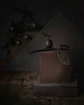 chocolate panna cotta with vanilla on a dark brown background. Conceptual artistic photo