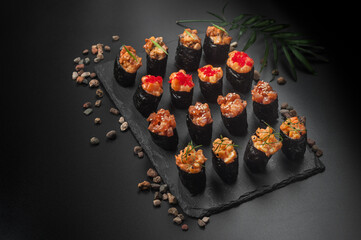 set of gunkan sushi on black background
