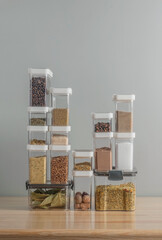 plastic containers with dry spices on a kitchen