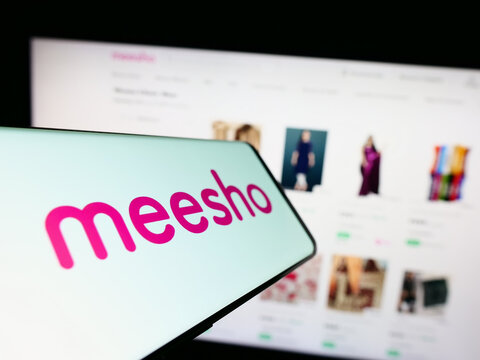 Stuttgart, Germany - 03-26-2023: Smartphone with logo of Indian e-commerce company Meesho on screen in front of business website. Focus on center of phone display.