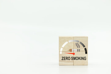 Wooden cubes with zero smoking icons on white background.Gauge arrow set to zero.Zero smoking.World No Tobacco Day. No Smoking Day Awareness.