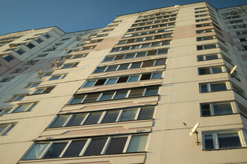 Windows in building. Many floors in house. Details of architecture in city.