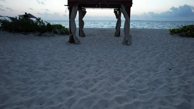 Sunrise fly through an arch. Gulf of Mexico, Located in Cancun, Mexico. Aerial 4K drone video