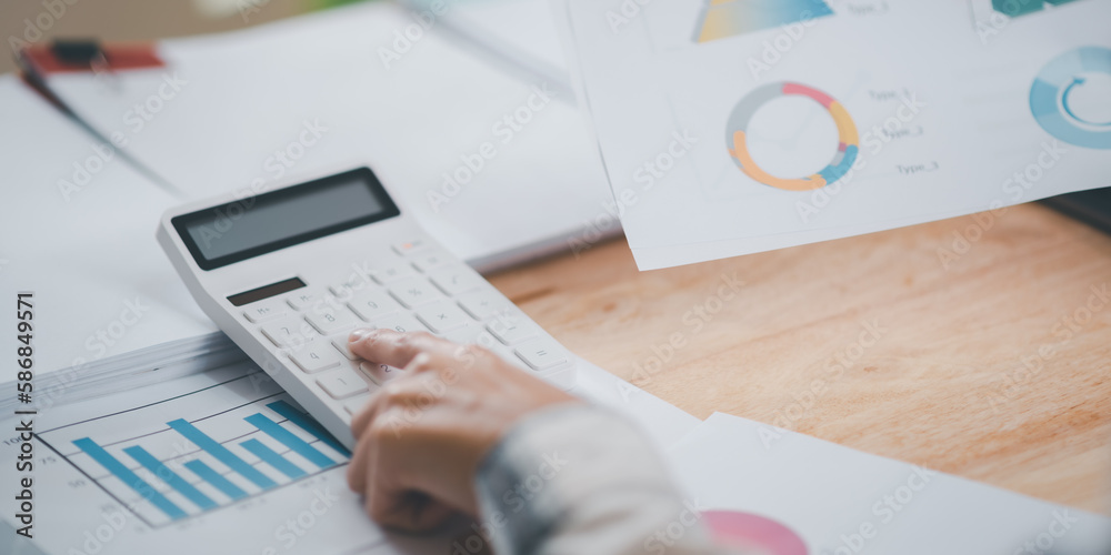 Poster businessman calculating figures in company financial documents with a calculator,analysis of company