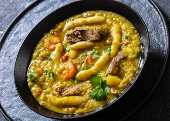 gungo peas soup with dumplings, veggies and beef