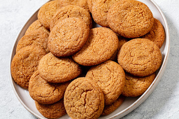 sweet soft ginger cookies on plate, top view